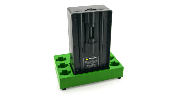 A green stand holds an electric device.