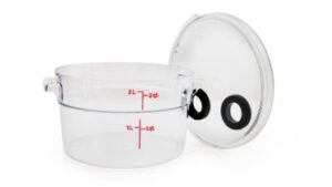 A plastic container with a lid and a measuring cup.