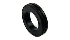 A black rubber ring is sitting on top of a white table.