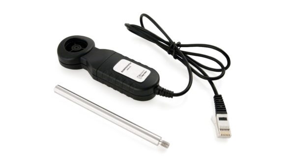 A black and silver cable, a usb cord and a remote control.